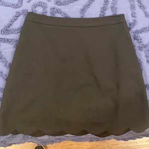 Black scallop mini skirt